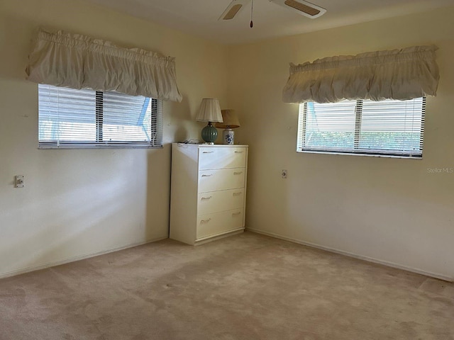 22321 Yonkers Ave, Port Charlotte, FL 33952 - unfurnished bedroom featuring light carpet and ceiling fan