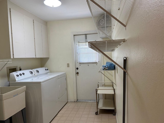 22321 Yonkers Ave, Port Charlotte, FL 33952 - laundry area featuring washer and dryer, cabinet space, and light flooring