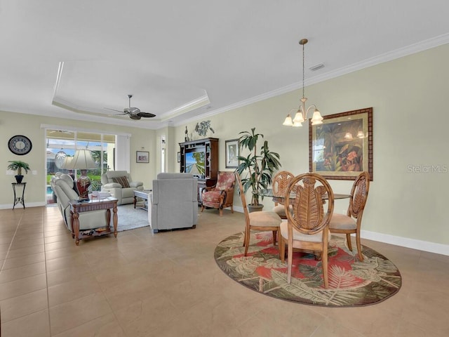 2749 Lambay Ct, Cape Coral, FL 33991 - dining room with crown molding, a tray ceiling, ceiling fan, a chandelier, and light tile patterned flooring