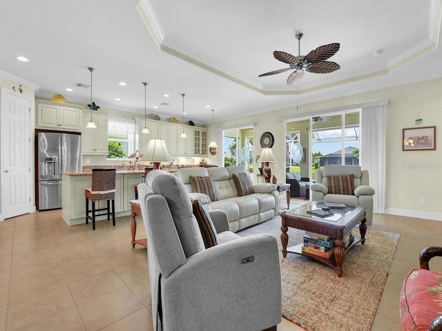 2749 Lambay Ct, Cape Coral, FL 33991 - living area featuring a raised ceiling, ornamental molding, a ceiling fan, light tile patterned floors, and recessed lighting
