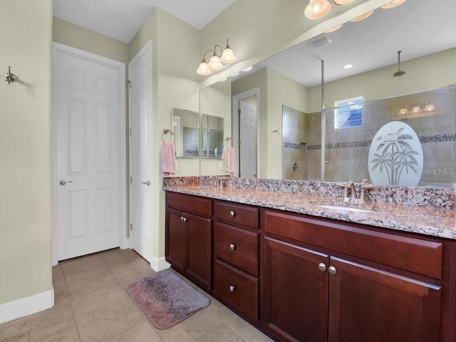 2749 Lambay Ct, Cape Coral, FL 33991 - bathroom featuring double vanity, a walk in shower, and tile patterned flooring