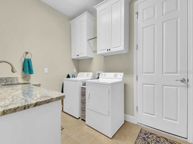 2749 Lambay Ct, Cape Coral, FL 33991 - laundry area with cabinet space, independent washer and dryer, and light tile patterned floors