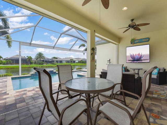 2749 Lambay Ct, Cape Coral, FL 33991 - view of patio / terrace with a ceiling fan, an outdoor pool, a water view, glass enclosure, and outdoor dining area