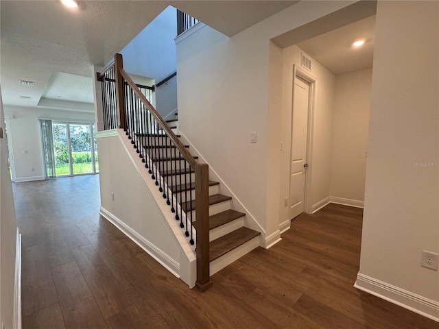 17134 Savory Mist Cir, Bradenton, FL 34211 - stairway with hardwood / wood-style flooring and recessed lighting
