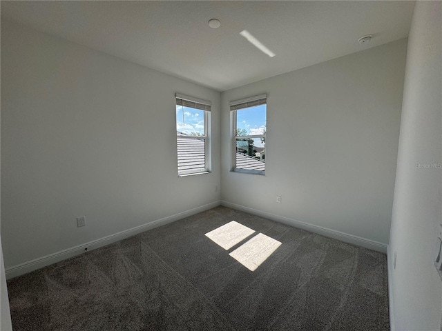 17134 Savory Mist Cir, Bradenton, FL 34211 - carpeted spare room with baseboards and a smoke detector