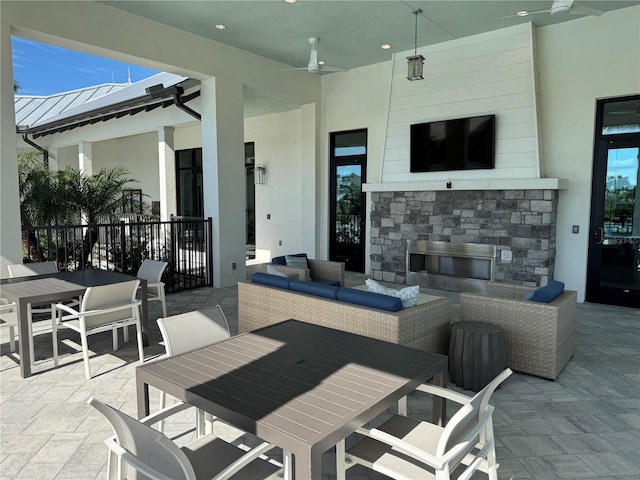 17134 Savory Mist Cir, Bradenton, FL 34211 - view of patio featuring outdoor dining area and an outdoor living space with a fireplace