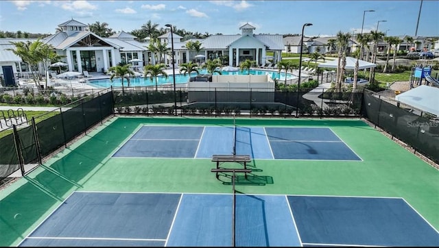 17134 Savory Mist Cir, Bradenton, FL 34211 - view of tennis court featuring a community pool and a residential view