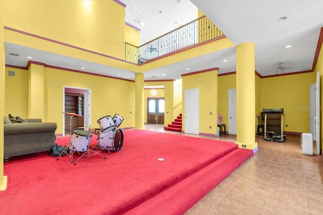 4105 37th St E, Bradenton, FL 34208 - building lobby with crown molding, a towering ceiling, stairs, and recessed lighting