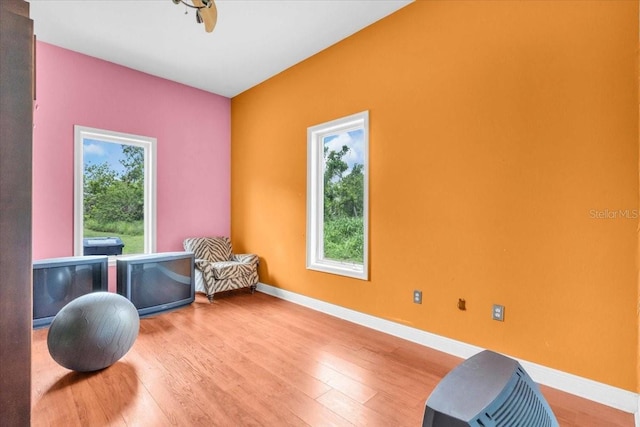 4105 37th St E, Bradenton, FL 34208 - workout area featuring baseboards and wood finished floors