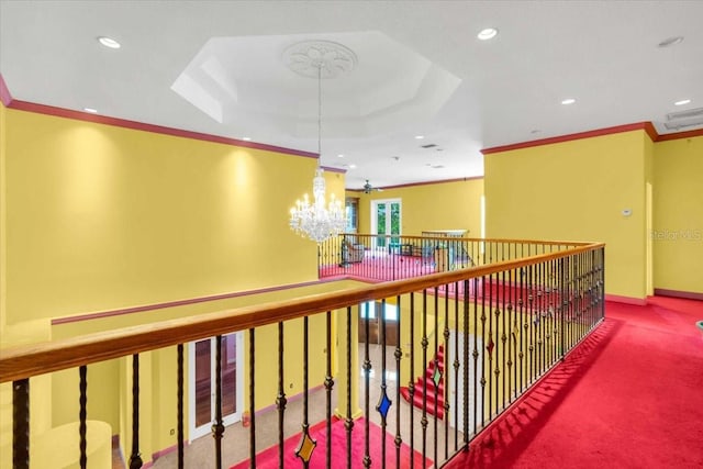4105 37th St E, Bradenton, FL 34208 - hallway with ornamental molding, carpet floors, recessed lighting, a chandelier, and a tray ceiling