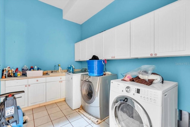 4105 37th St E, Bradenton, FL 34208 - laundry area featuring cabinet space, separate washer and dryer, and light tile patterned floors