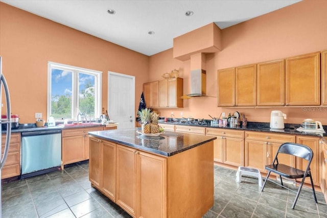 4105 37th St E, Bradenton, FL 34208 - kitchen featuring stainless steel appliances, wall chimney range hood, a kitchen island, dark stone countertops, and light brown cabinets