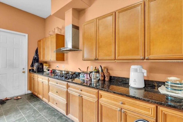 4105 37th St E, Bradenton, FL 34208 - kitchen featuring wall chimney range hood, gas stovetop, and dark stone countertops