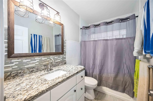 3641 Stokes Dr, Sarasota, FL 34232 - bathroom with vanity, tile walls, and shower / bathtub combination with curtain