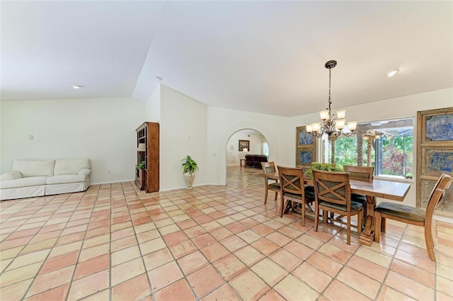 3217 Oak Grove Dr, Sarasota, FL 34243 - dining space featuring arched walkways, a chandelier, and vaulted ceiling