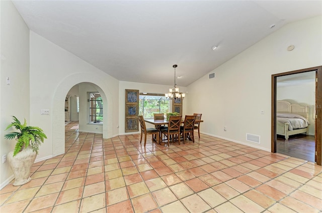 3217 Oak Grove Dr, Sarasota, FL 34243 - dining room featuring vaulted ceiling, arched walkways, a chandelier, and light tile patterned floors