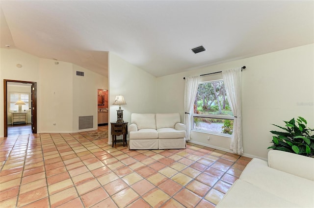 3217 Oak Grove Dr, Sarasota, FL 34243 - living room featuring lofted ceiling and light tile patterned floors