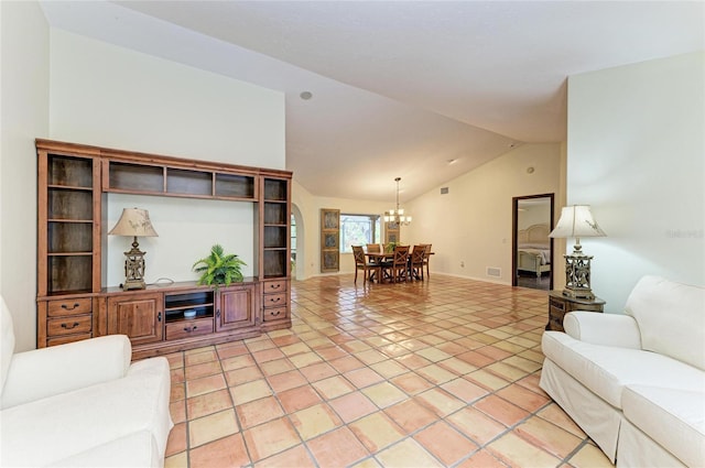 3217 Oak Grove Dr, Sarasota, FL 34243 - living room with vaulted ceiling, a chandelier, and light tile patterned floors