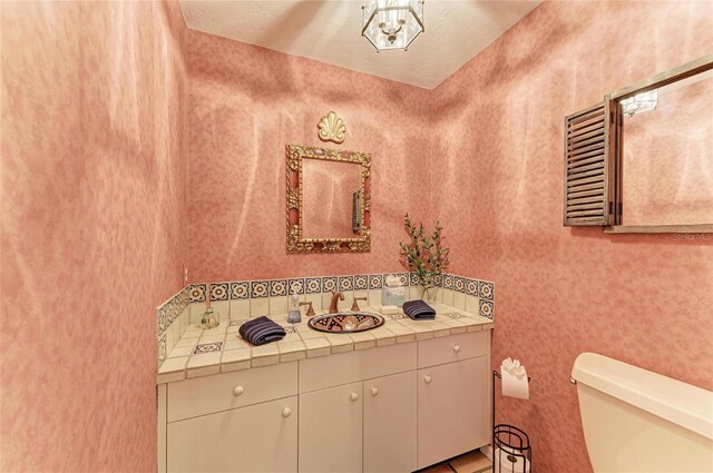 3217 Oak Grove Dr, Sarasota, FL 34243 - half bathroom featuring toilet and vanity