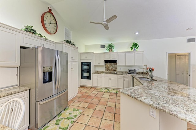 3217 Oak Grove Dr, Sarasota, FL 34243 - kitchen featuring black appliances, a peninsula, ceiling fan, light tile patterned floors, and light stone counters