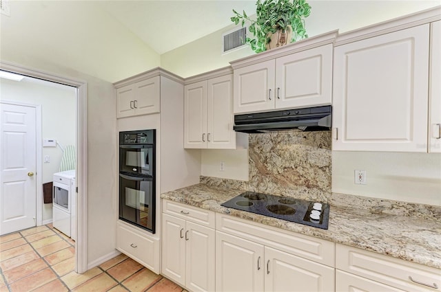 3217 Oak Grove Dr, Sarasota, FL 34243 - kitchen with black appliances, extractor fan, washer / clothes dryer, backsplash, and light tile patterned floors