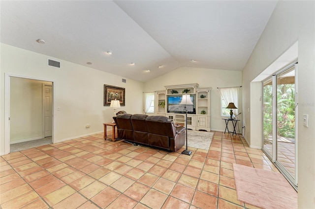 3217 Oak Grove Dr, Sarasota, FL 34243 - living room with lofted ceiling and light tile patterned floors