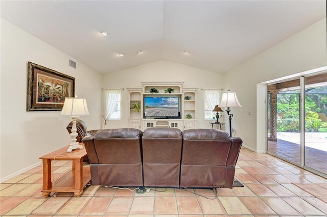 3217 Oak Grove Dr, Sarasota, FL 34243 - living room featuring lofted ceiling and light tile patterned flooring