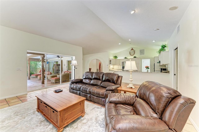 3217 Oak Grove Dr, Sarasota, FL 34243 - living area with lofted ceiling, a ceiling fan, and light tile patterned floors