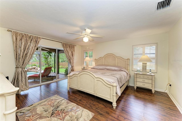 3217 Oak Grove Dr, Sarasota, FL 34243 - bedroom featuring access to exterior, multiple windows, dark wood finished floors, and ceiling fan