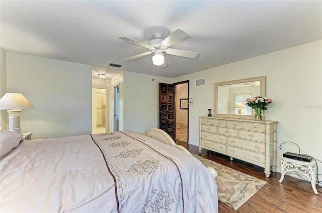 3217 Oak Grove Dr, Sarasota, FL 34243 - bedroom featuring wood finished floors, a ceiling fan, and connected bathroom