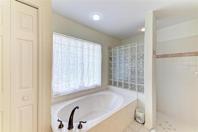 3217 Oak Grove Dr, Sarasota, FL 34243 - full bathroom featuring a bath, tiled shower, and tile patterned floors