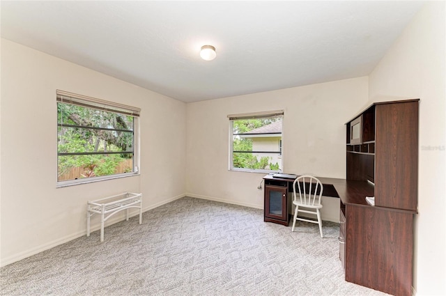 3217 Oak Grove Dr, Sarasota, FL 34243 - unfurnished office with healthy amount of natural light and carpet floors