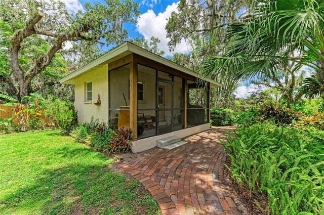 3217 Oak Grove Dr, Sarasota, FL 34243 - view of outbuilding featuring a sunroom