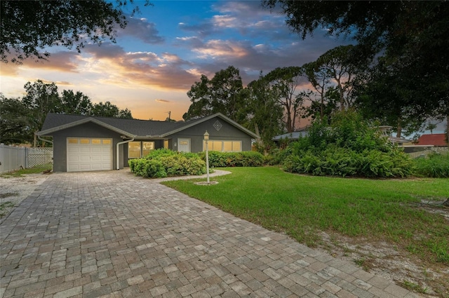 5415 13th Avenue Dr W, Bradenton, FL 34209 - view of front of property with a garage, decorative driveway, and stucco siding