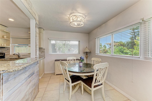 5415 13th Avenue Dr W, Bradenton, FL 34209 - dining room with light tile patterned floors and a textured ceiling