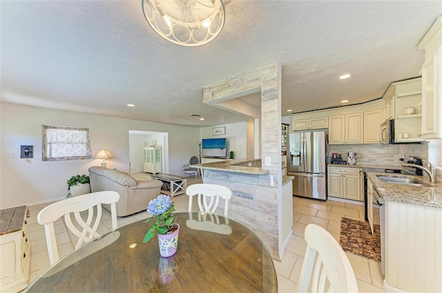 5415 13th Avenue Dr W, Bradenton, FL 34209 - dining area with recessed lighting, light tile patterned floors, and a textured ceiling