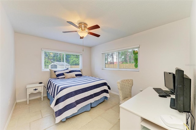 5415 13th Avenue Dr W, Bradenton, FL 34209 - bedroom with light tile patterned floors, ceiling fan, and a desk