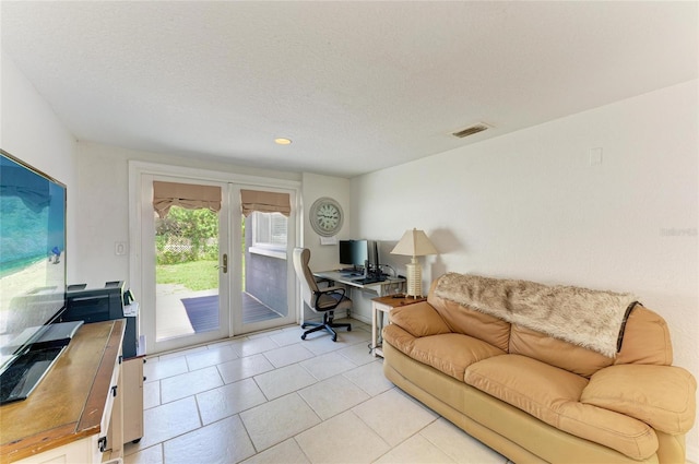 5415 13th Avenue Dr W, Bradenton, FL 34209 - home office featuring french doors, a textured ceiling, and light tile patterned flooring