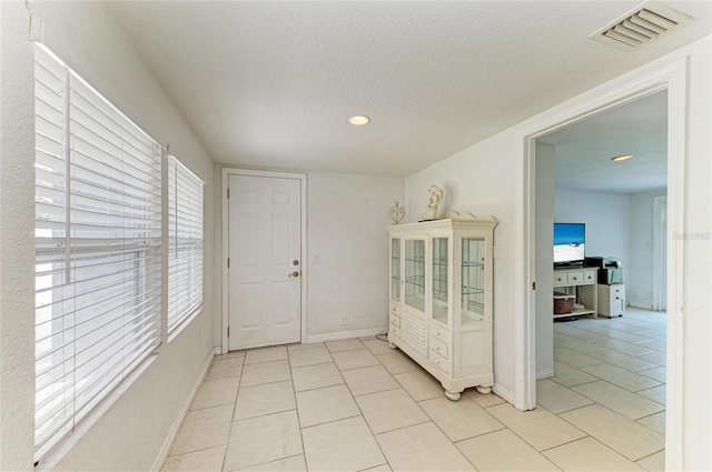 5415 13th Avenue Dr W, Bradenton, FL 34209 - interior space featuring light tile patterned floors, healthy amount of natural light, a textured ceiling, and recessed lighting