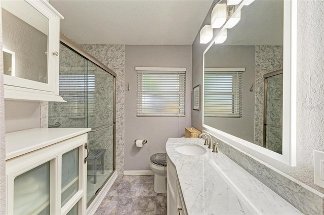 5415 13th Avenue Dr W, Bradenton, FL 34209 - full bathroom featuring vanity, a shower stall, and a textured ceiling