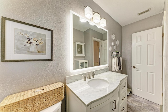5415 13th Avenue Dr W, Bradenton, FL 34209 - bathroom featuring a textured wall and vanity