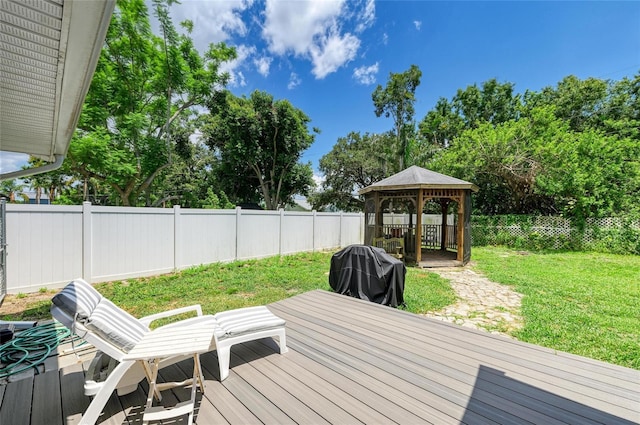 5415 13th Avenue Dr W, Bradenton, FL 34209 - wooden deck with a gazebo, a fenced backyard, and grilling area