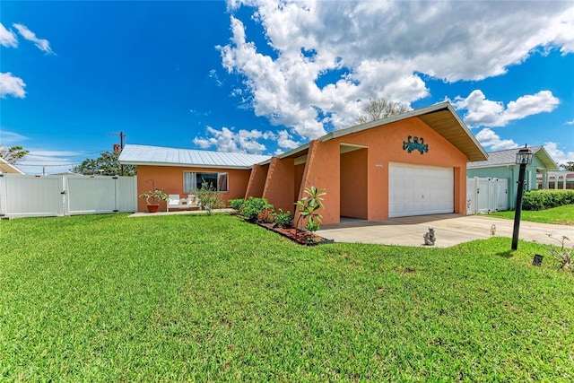 2406 15th St W, Palmetto, FL 34221 - ranch-style house with stucco siding, a gate, a garage, and driveway