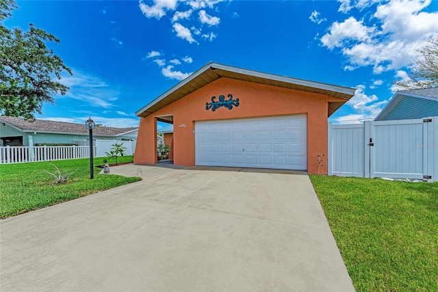 2406 15th St W, Palmetto, FL 34221 - view of front of property with stucco siding, a gate, and concrete driveway
