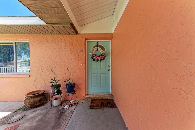 2406 15th St W, Palmetto, FL 34221 - doorway to property featuring stucco siding