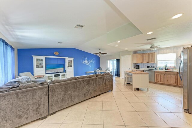 2406 15th St W, Palmetto, FL 34221 - living area with ceiling fan, light tile patterned floors, recessed lighting, and vaulted ceiling