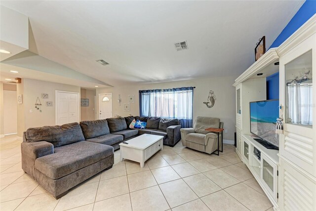 2406 15th St W, Palmetto, FL 34221 - living area with light tile patterned floors, recessed lighting, and lofted ceiling