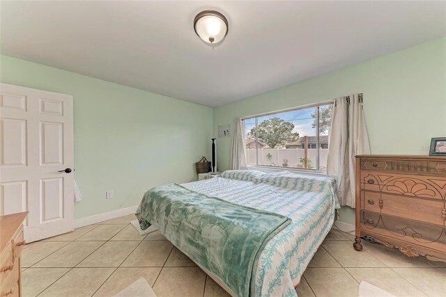 2406 15th St W, Palmetto, FL 34221 - bedroom with light tile patterned flooring