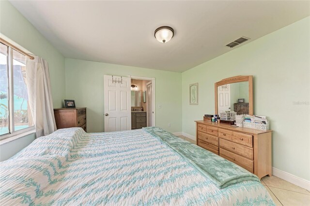 2406 15th St W, Palmetto, FL 34221 - bedroom featuring baseboards and light tile patterned flooring
