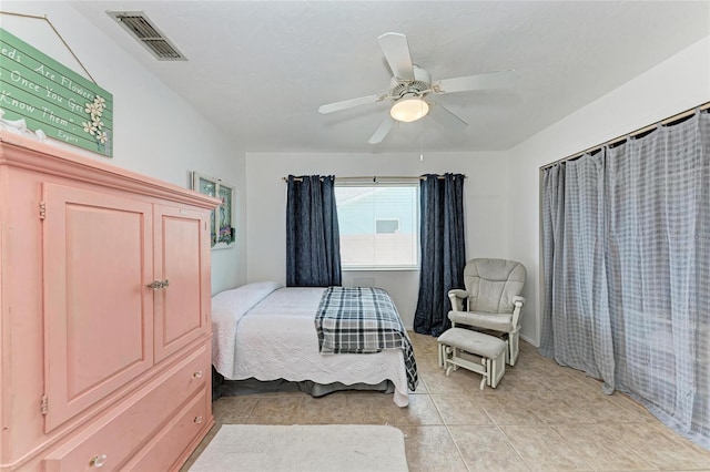 2406 15th St W, Palmetto, FL 34221 - bedroom with light tile patterned floors and ceiling fan